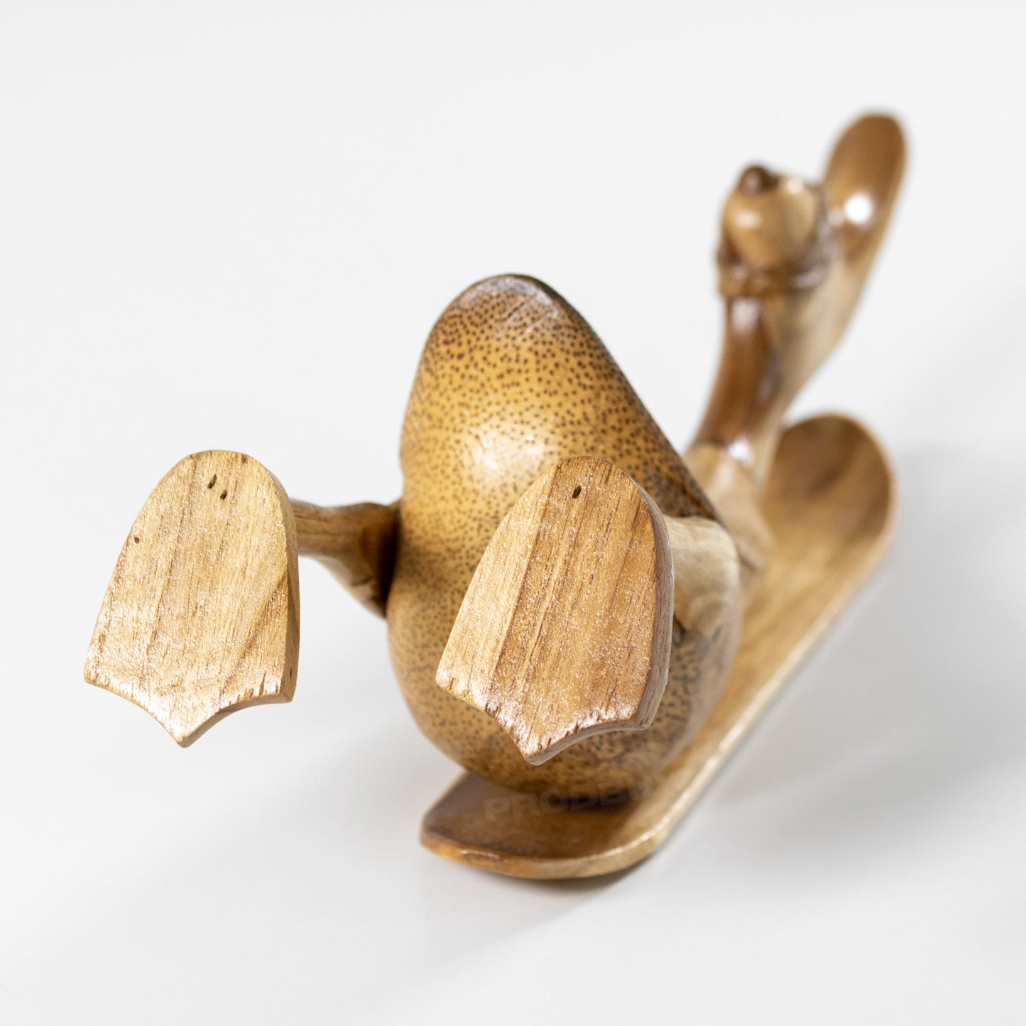 Teak Wood Duck on Snowboard Sculpture
