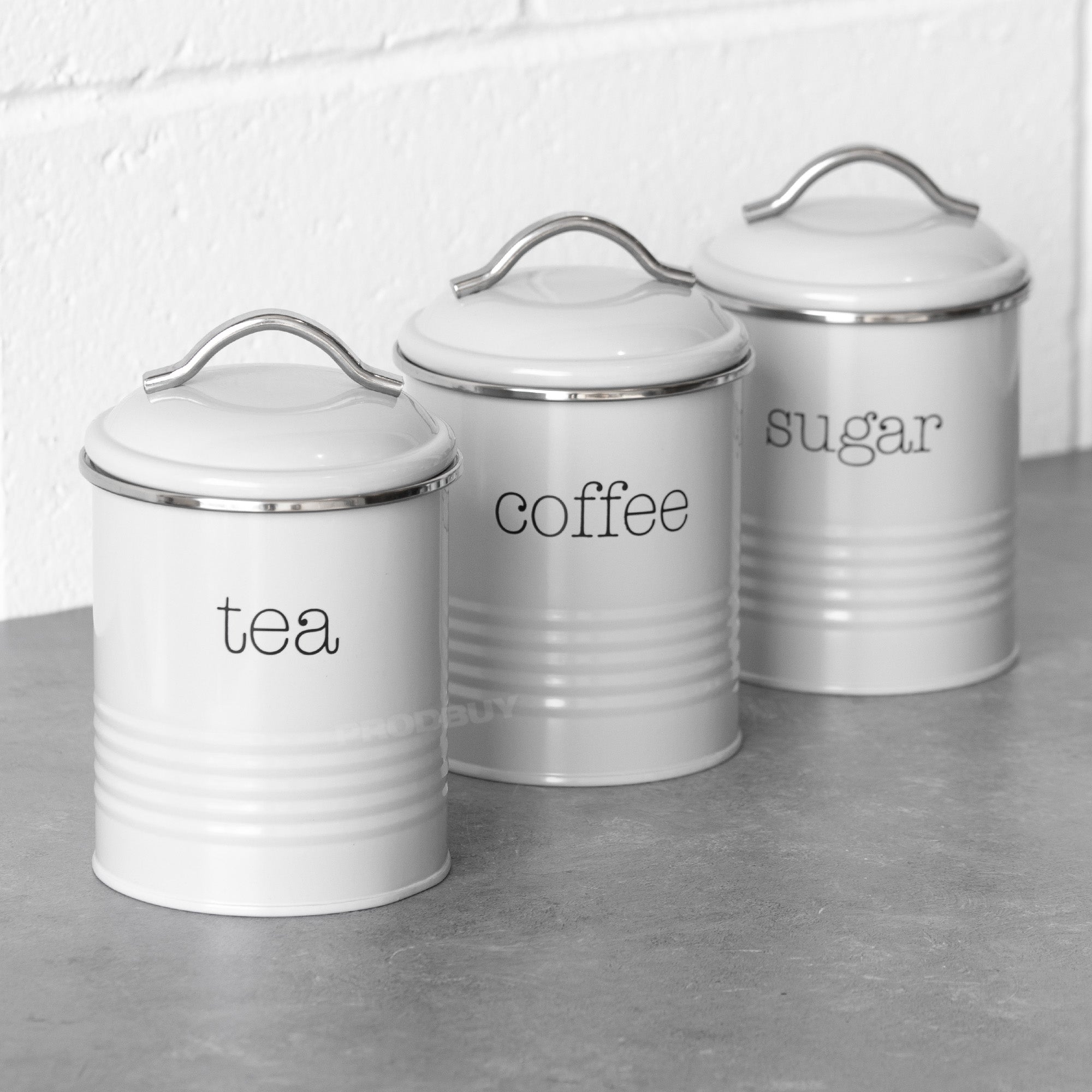 White and silver tea store coffee and sugar canisters